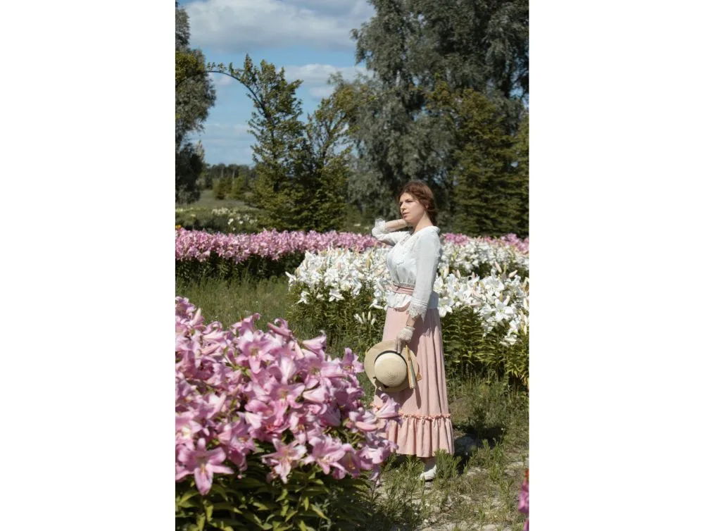 Edwardian style costume with pink skirt