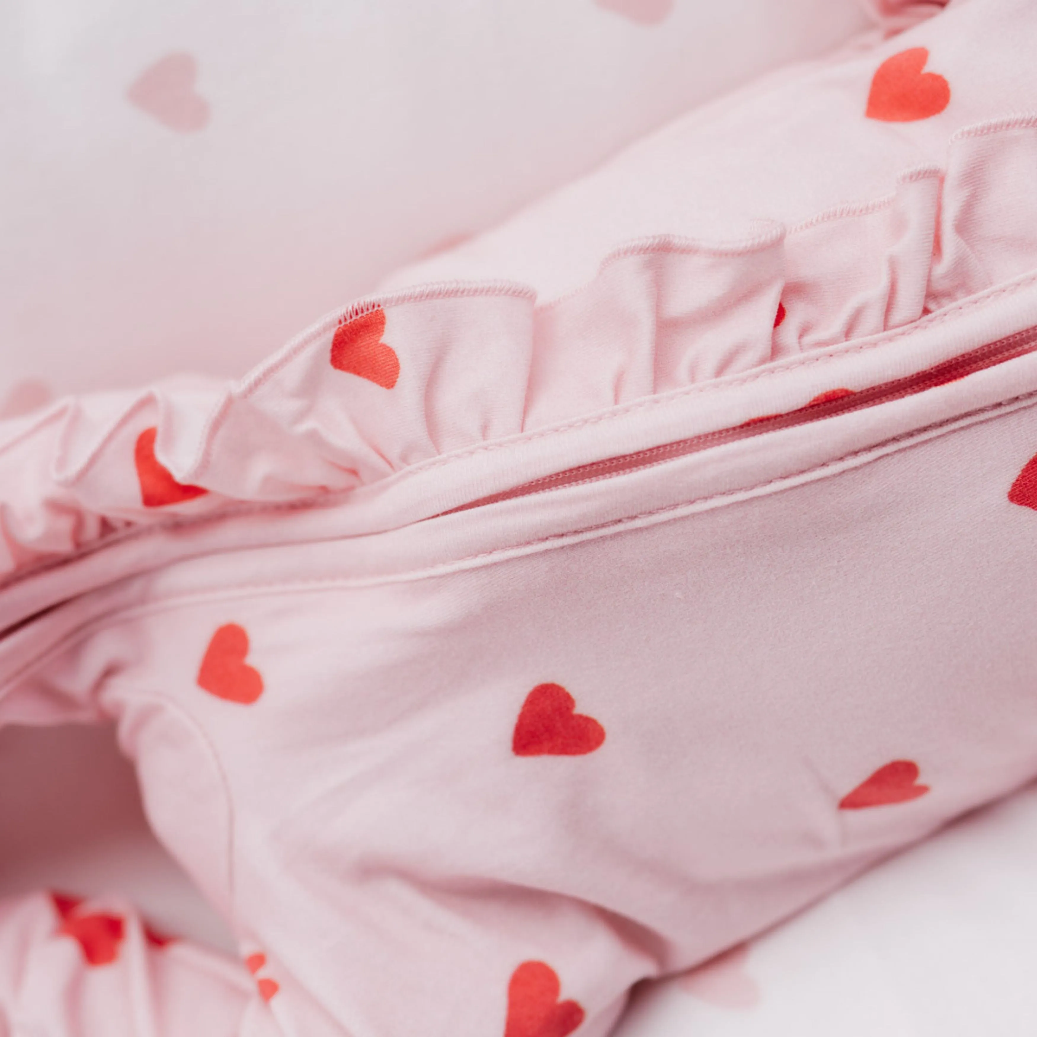 FRILL ZIP ROMPER | RED HEARTS
