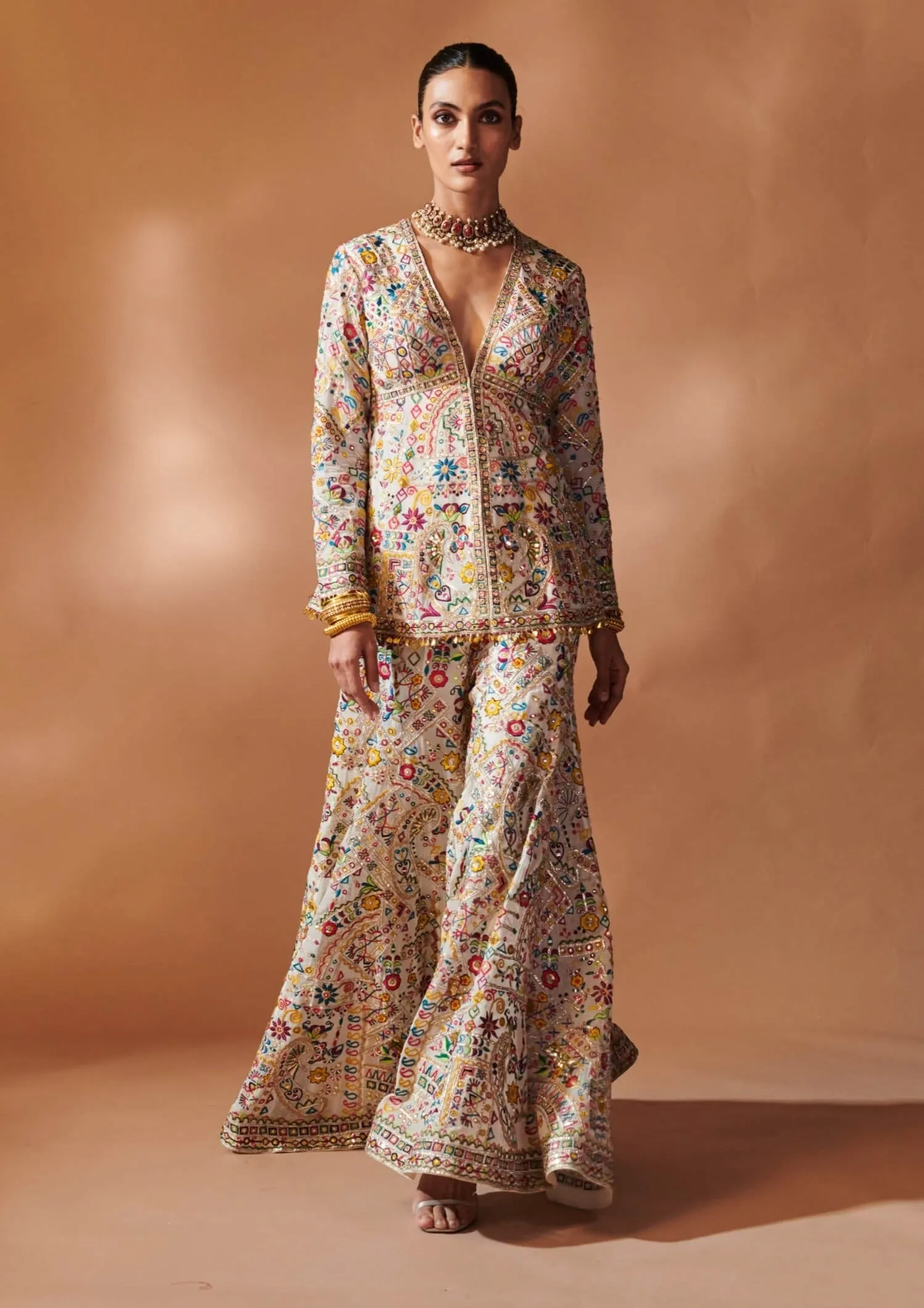 Ivory embroidered peplum sharara set