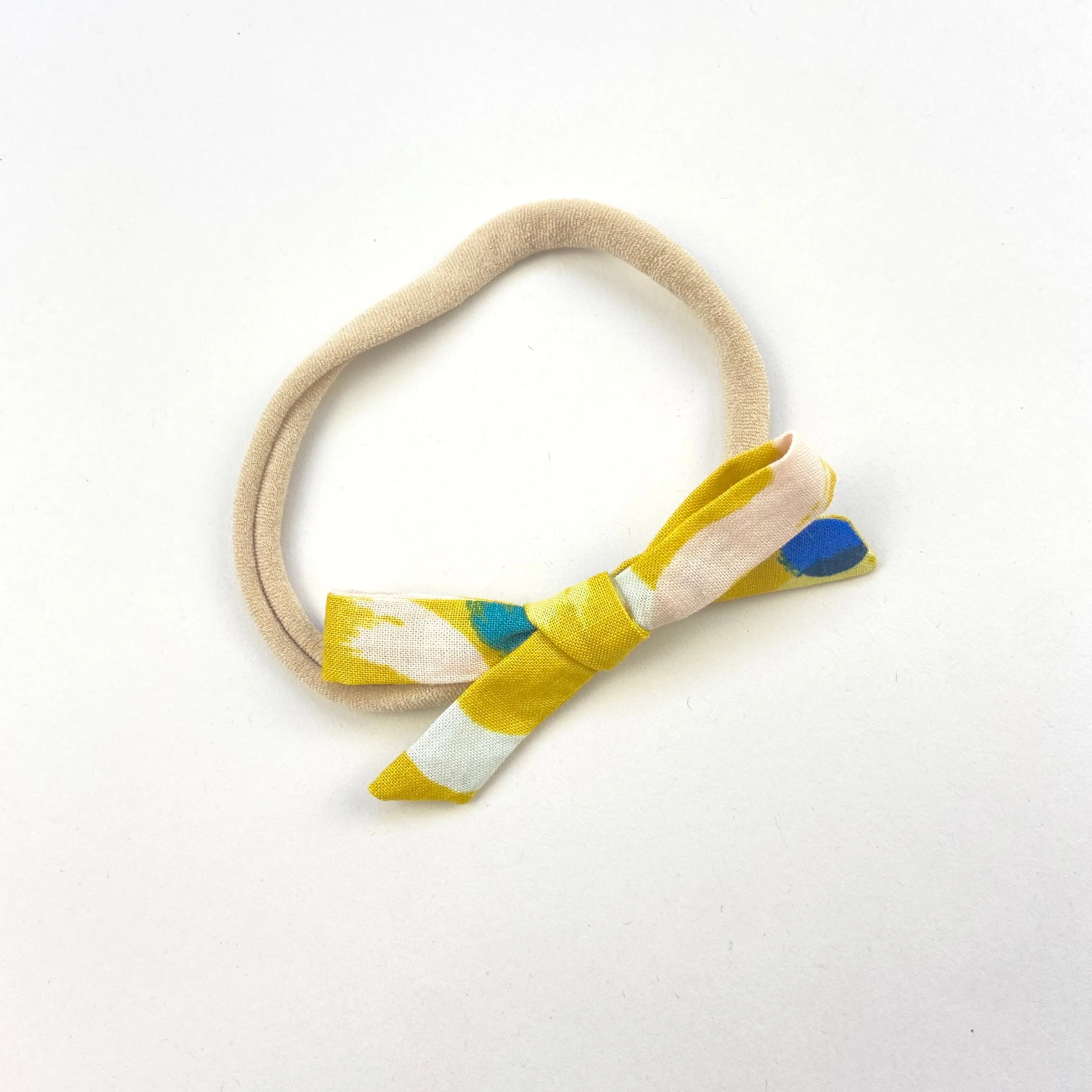 MUSTARD BRUSHSTROKE ORLA BOW HEADBAND