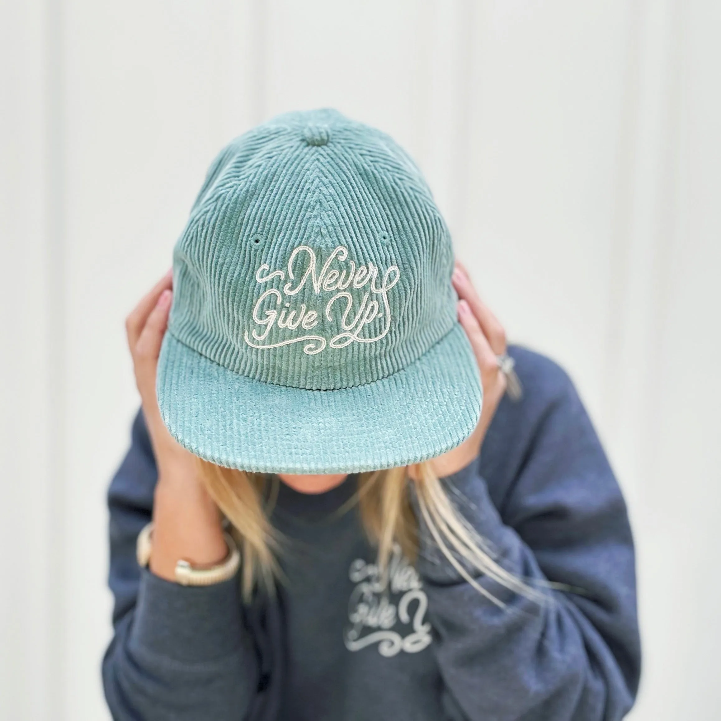 NEVER GIVE UP. CORD HAT