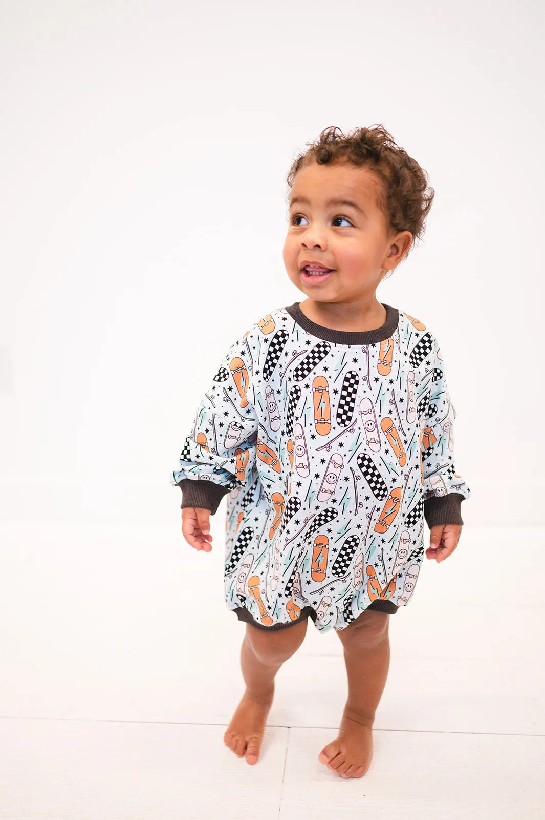 Oversized Cozy Romper - Retro Skateboard