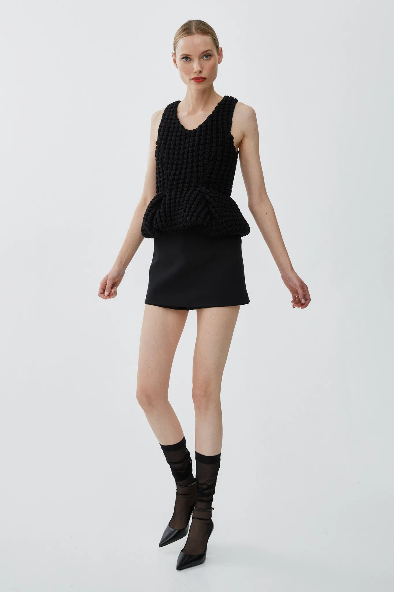 Slim fit peplum black top in waffle wool