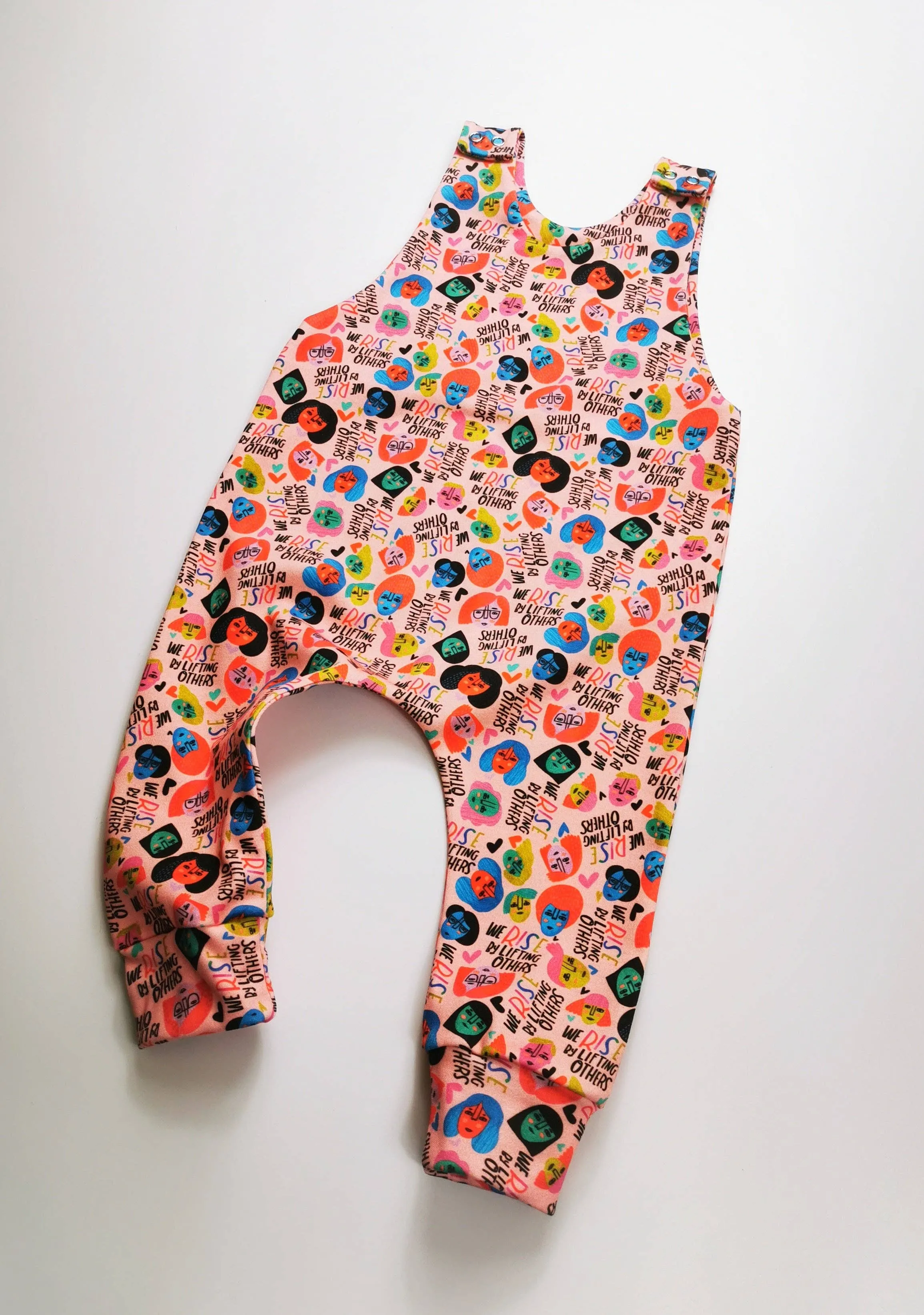 We Rise by Lifting Others Romper