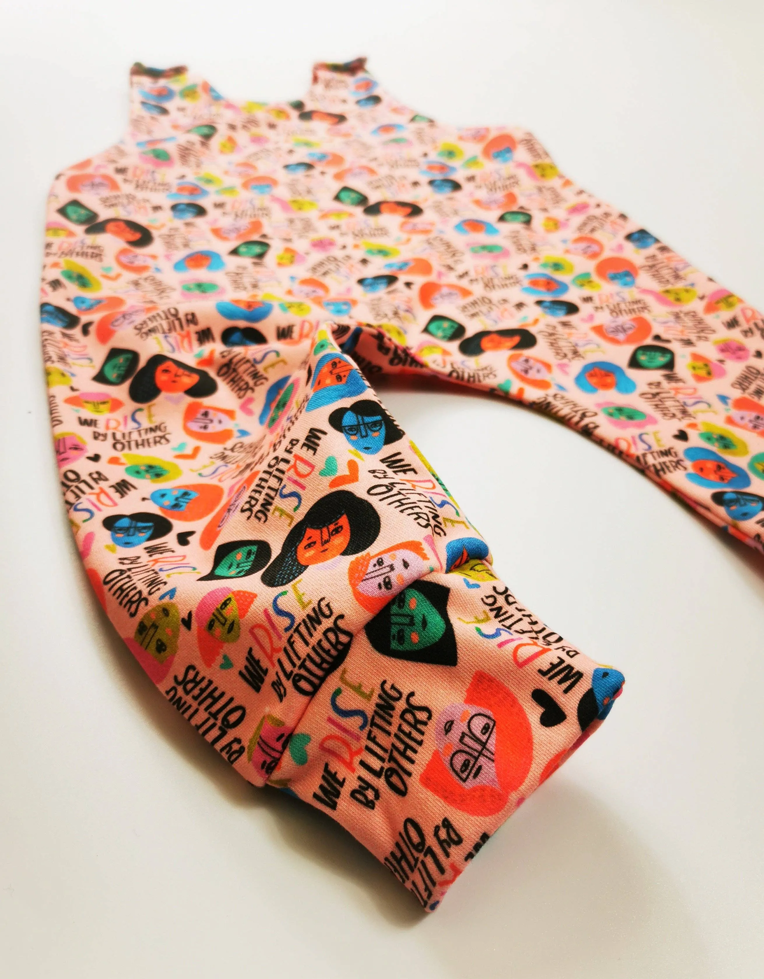 We Rise by Lifting Others Romper