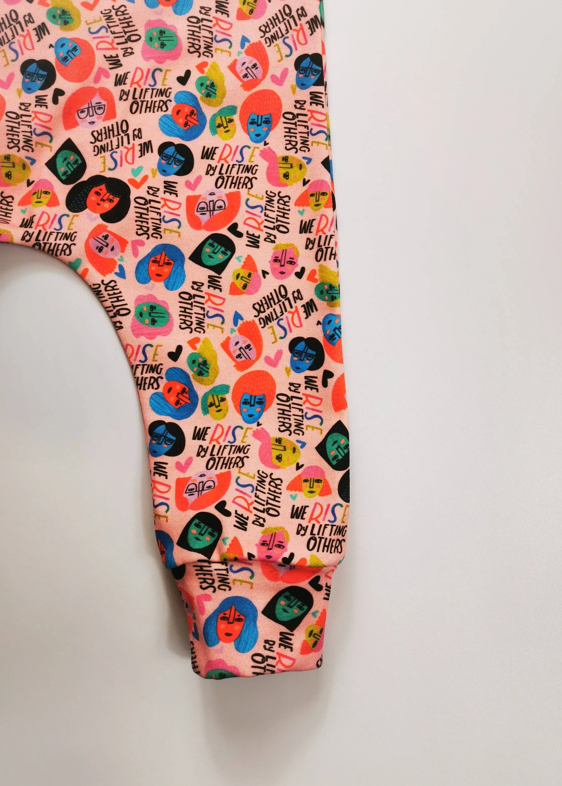 We Rise by Lifting Others Romper
